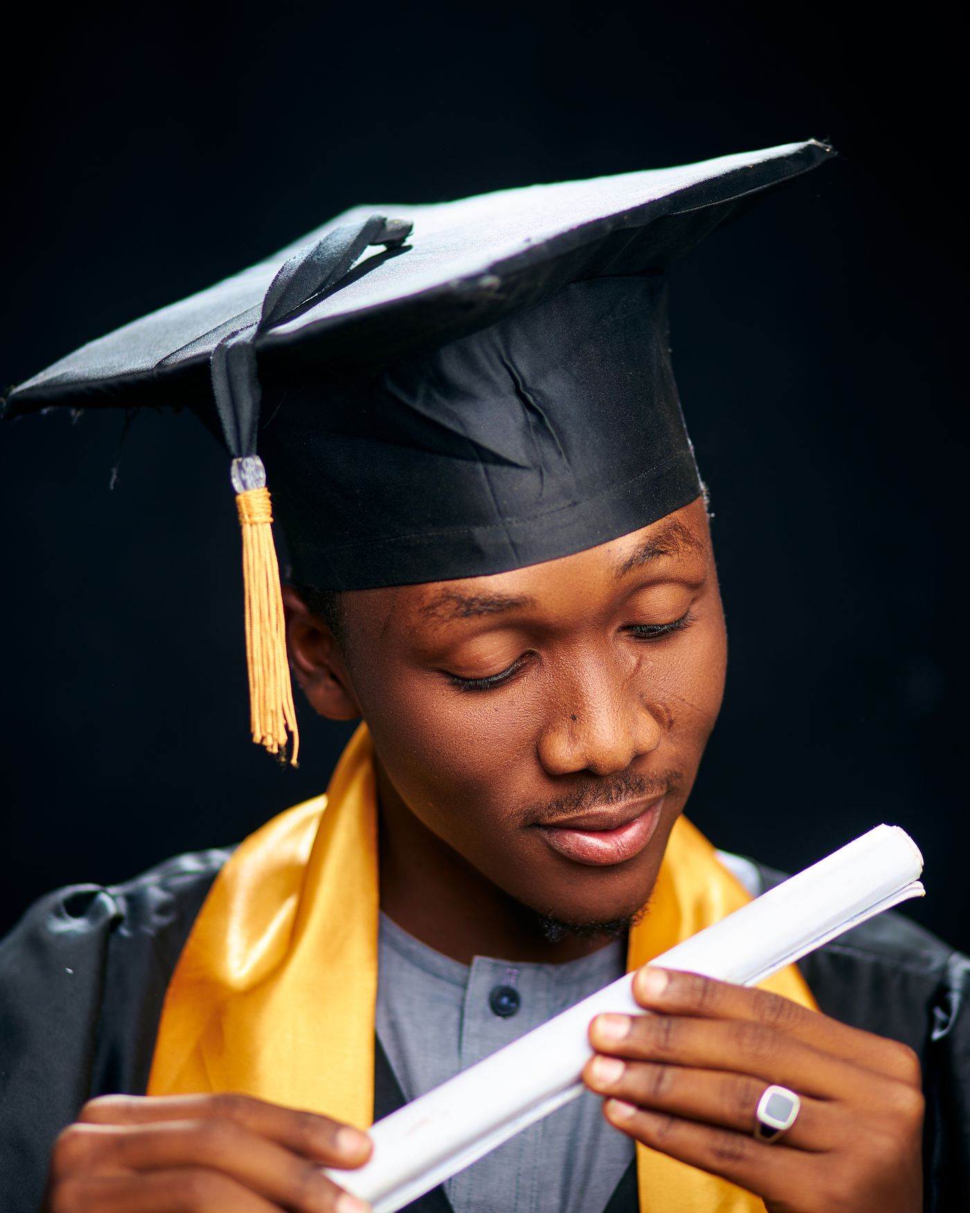 African graduate celebrating tertiary education success
